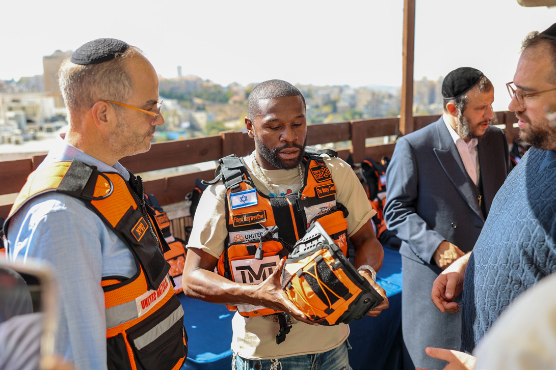 Floyd Mayweather wearing a United Hatzalah volunteer vest in Jerusalem